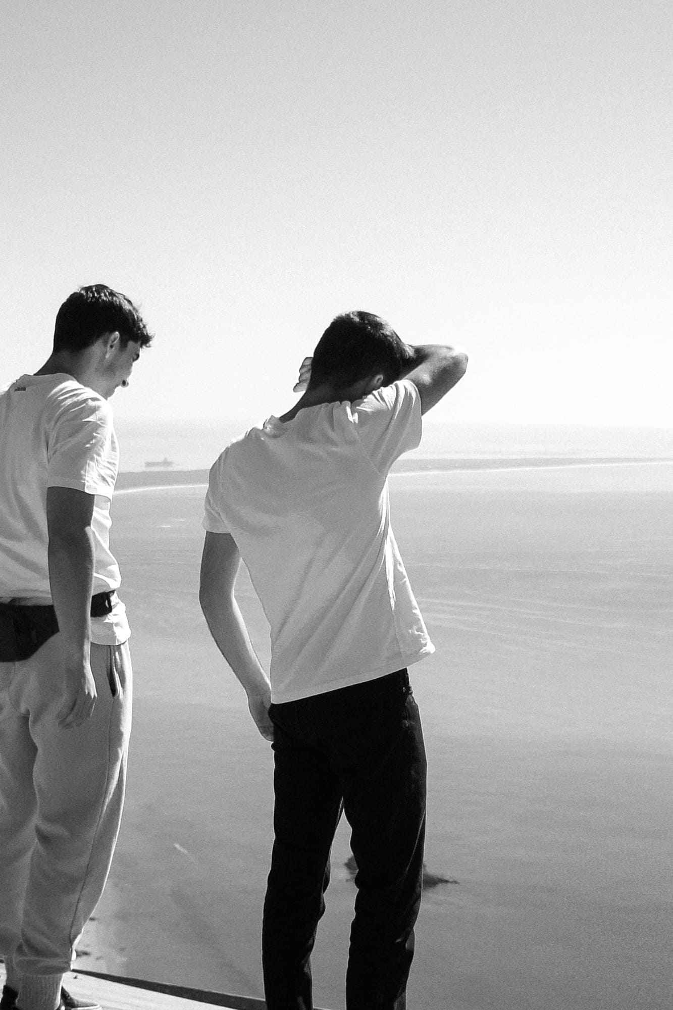 person blocking sun with arm