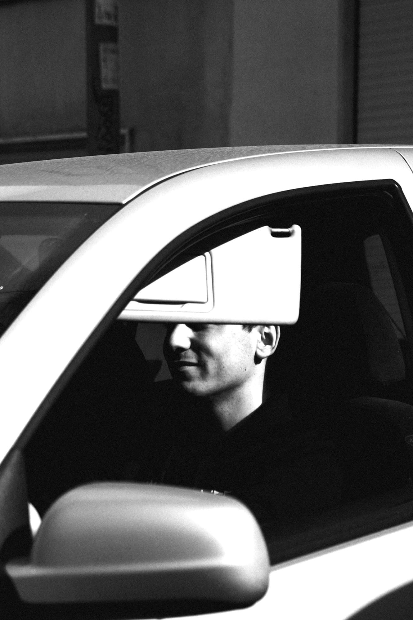 person blocking sun in car